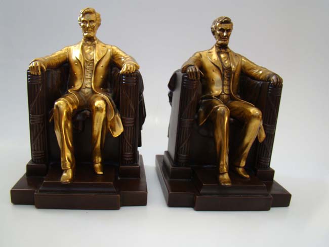 A pair of "LINCOLN in the Chair" bookends made by Jennings Brothers circa 1935